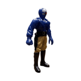 Side profile of the Armored Captain Gatezone sofubi figure from Kamen Rider Black RX (1988). The figure features a blue sculpted torso with armor-like ridges, beige pants, and black boots. The helmeted head includes a red circular detail, suggesting a robotic or villainous theme. A black belt with a holster hangs from the right side. The stylized proportions and paint application reflect the gritty aesthetic of late-80s tokusatsu design.