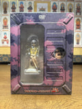 A photograph of the front of the Full Metal Panic! Mission 5 limited edition DVD box set resting on a wooden surface. The packaging is still in its original clear plastic shrink-wrap, showcasing the Tessa Testarossa figurine and the series title in Japanese text at the bottom.