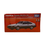 Front of the Tomica Premium No. 14 Toyota Celica XX box showing the silver and black model car illustration, with branding from Tomica and Takara Tomy, and commemorative Japanese text for the release edition.