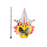 Brightly colored bird-themed mask with red eyes, yellow beak, and feather details, shown next to a measuring tape.