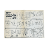 Instruction sheet for the Red Mechander model kit showing labeled parts and step-by-step assembly diagrams in Japanese and English, with arrows guiding the build process.