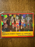 "Collection of six Ultraman-themed trading cards arranged on a wooden surface. Five cards have holographic designs with red borders and Chinese text boxes, featuring characters like Father of Ultra, Mother of Ultra, Zoffy, and a group of eight Ultramen. The central card is non-holographic with a close-up of an Ultraman character and 'ULTRAMAN' printed in red."