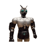 Side profile of the Shadowmoon sofubi figure from Kamen Rider Black (1988), posed in a combat-ready stance with clenched fists. The figure features segmented silver armor with black highlights, green eyes, and matching green accents on the belt and lower legs. The helmet includes antennae and a sculpted crest, reinforcing the character’s futuristic and insectoid design. Ideal for showcasing the figure’s silhouette and dynamic proportions.