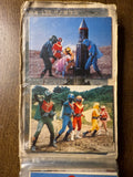 Photo album page with two vintage Himitsu Sentai Goranger photographs. The top image shows costumed heroes around a rocket-like object in a barren landscape, with a pink-suited character appearing distressed. The bottom image features five color-coded heroes (red, blue, yellow, green, pink) in dynamic poses in a forest. Both images include “NET・日本教育,” referencing Nippon Educational Television, the original broadcaster of the series.