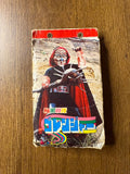 Vintage Japanese notebook cover featuring a villain from Himitsu Sentai Goranger. The character wears a red and black costume with a mask and holds a spiked weapon, standing in a rocky outdoor setting. The top of the notebook has a red border with metal-reinforced holes for binder use. Stylized Japanese text at the bottom reads “秘密戦隊ゴレンジャー,” confirming the item’s origin from the original Goranger series.