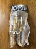 Front view of a vintage Marmit Shapley Alien sofubi figure sealed in a clear plastic bag. The header card reads “KAIJU” in bold, jagged lettering. The figure wears a metallic gold outfit with white trim and a silver perforated helmet resembling a vented dome. The humanoid body features white gloves, boots, and a high white collar, evoking a retro sci-fi aesthetic. Packaging is intact and designed for display.