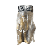 Front view of a vintage Marmit Shapley Alien sofubi figure sealed in a clear plastic bag. The header card reads “KAIJU” in bold, jagged lettering. The figure wears a metallic gold outfit with white trim and a silver perforated helmet resembling a vented dome. The humanoid body features white gloves, boots, and a high white collar, evoking a retro sci-fi aesthetic. Packaging is intact and designed for display.